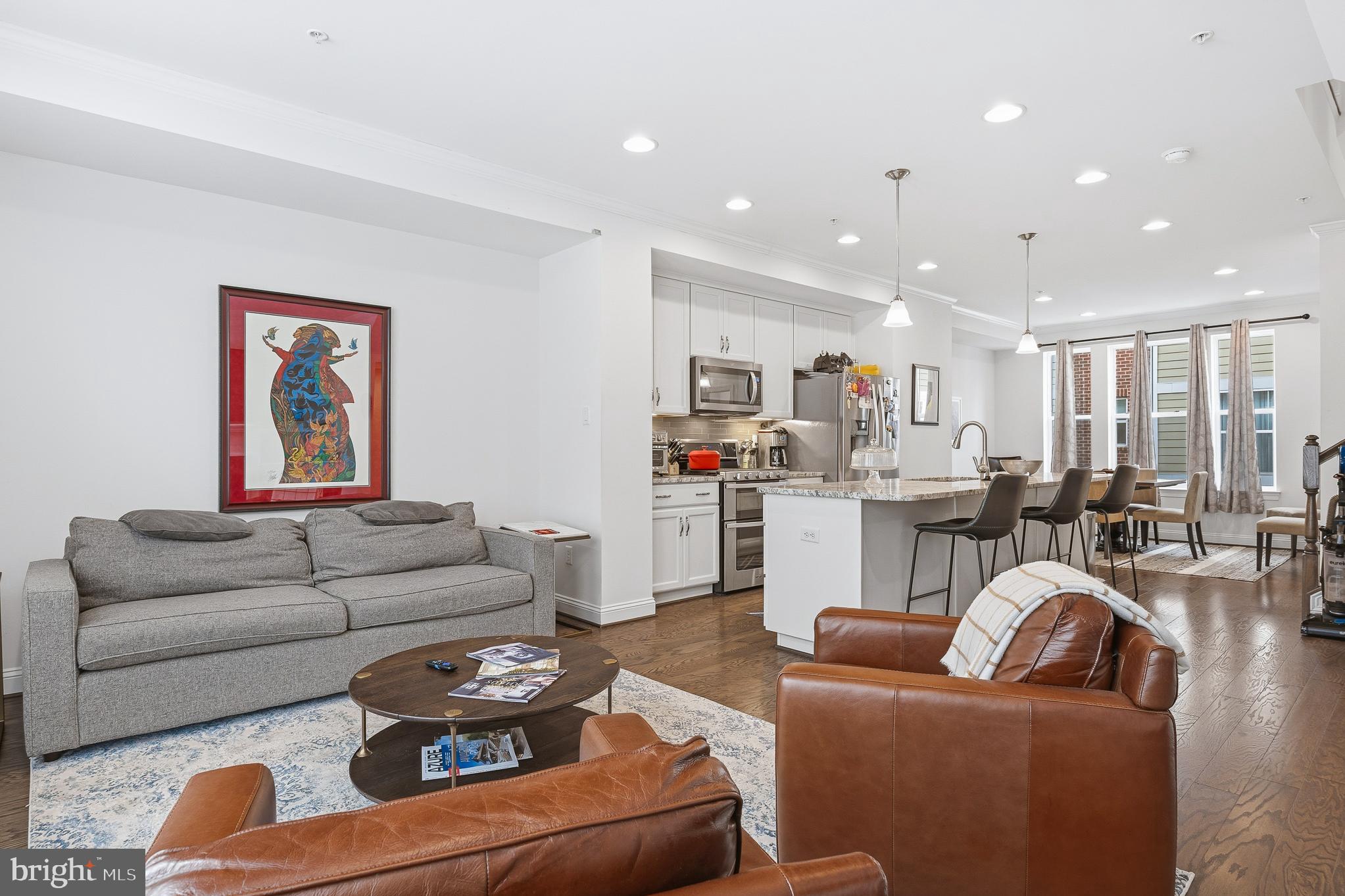 803 Francis Harris Place Annapolis, MD 21401 - Photo 48 of 52 a living room with furniture and a view of kitchen