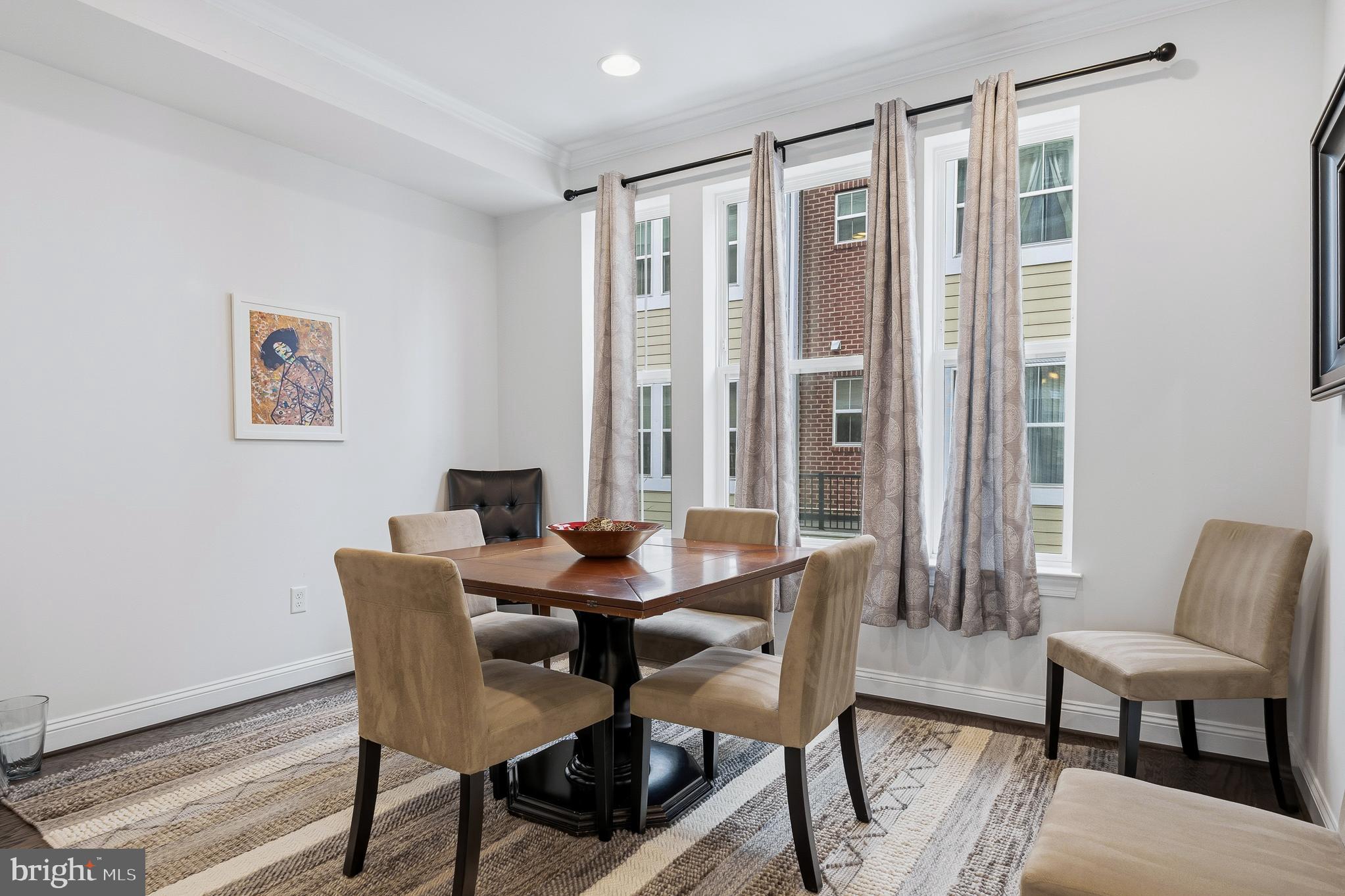 803 Francis Harris Place Annapolis, MD 21401 - Photo 24 of 52 a view of a a dining room with furniture window and wooden floor