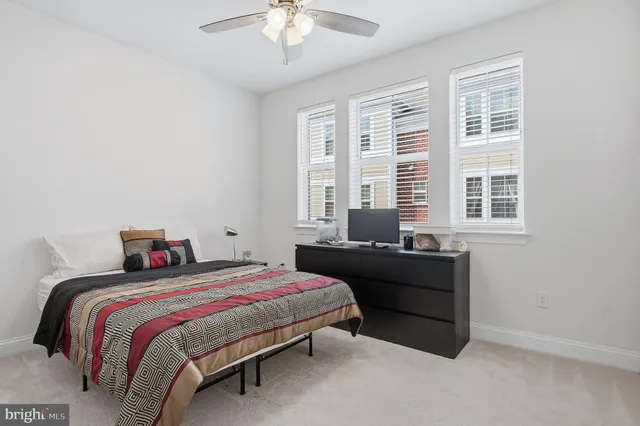 a view of walk in closet with clothes