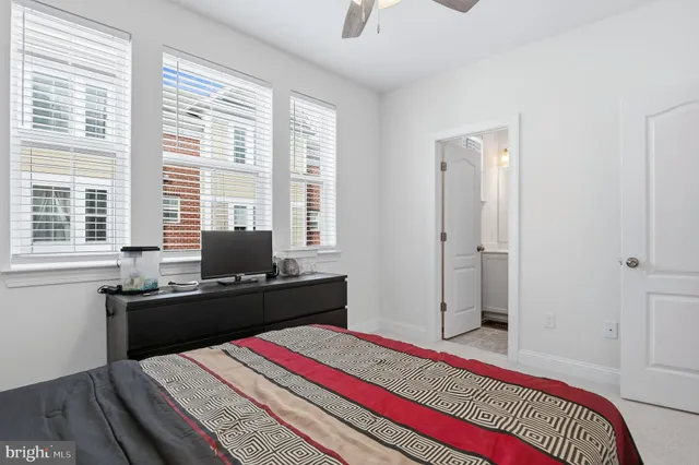 a bedroom with a bed and a bathroom