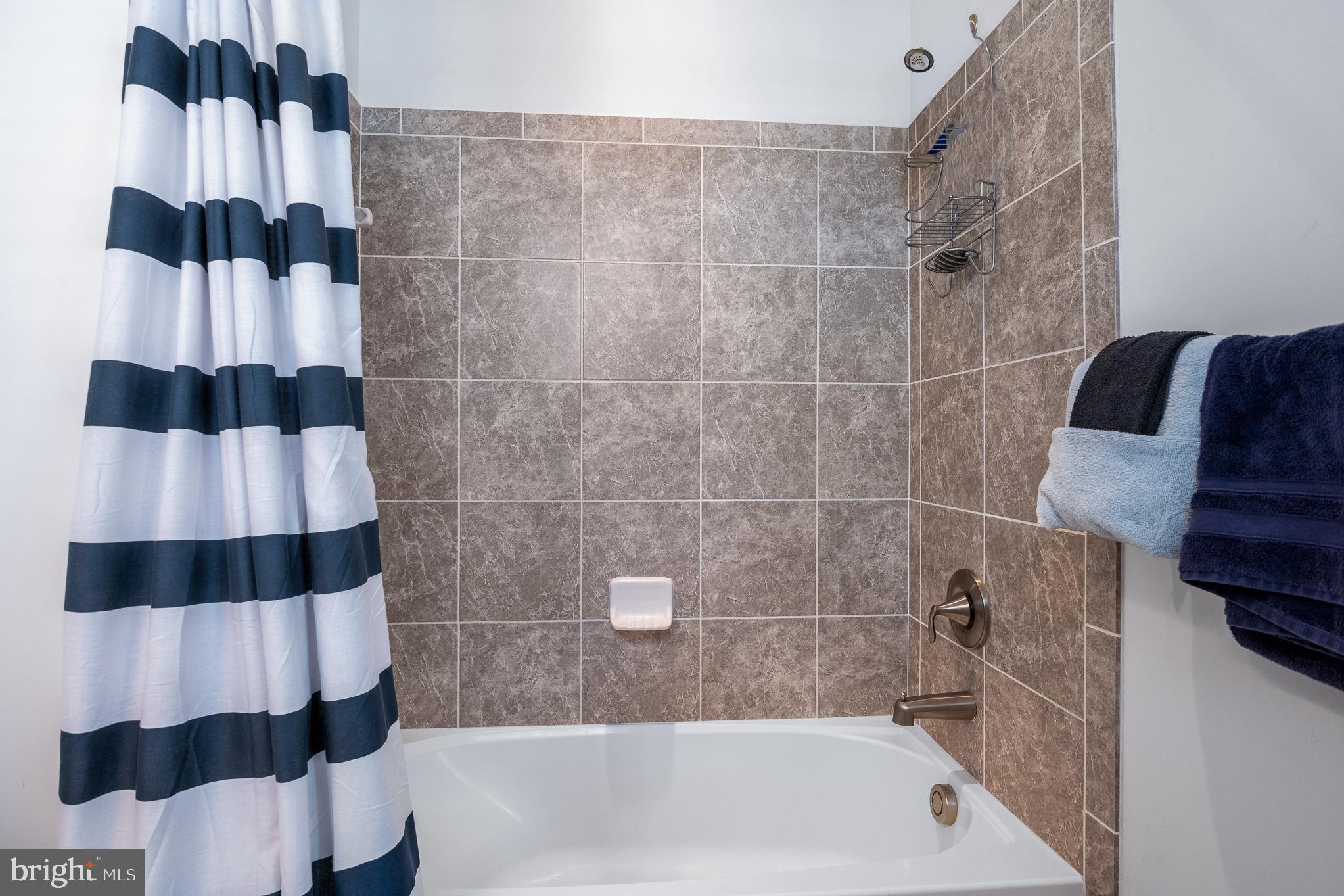 803 Francis Harris Place Annapolis, MD 21401 - Photo 36 of 52 a bathroom with a bathtub and a shower