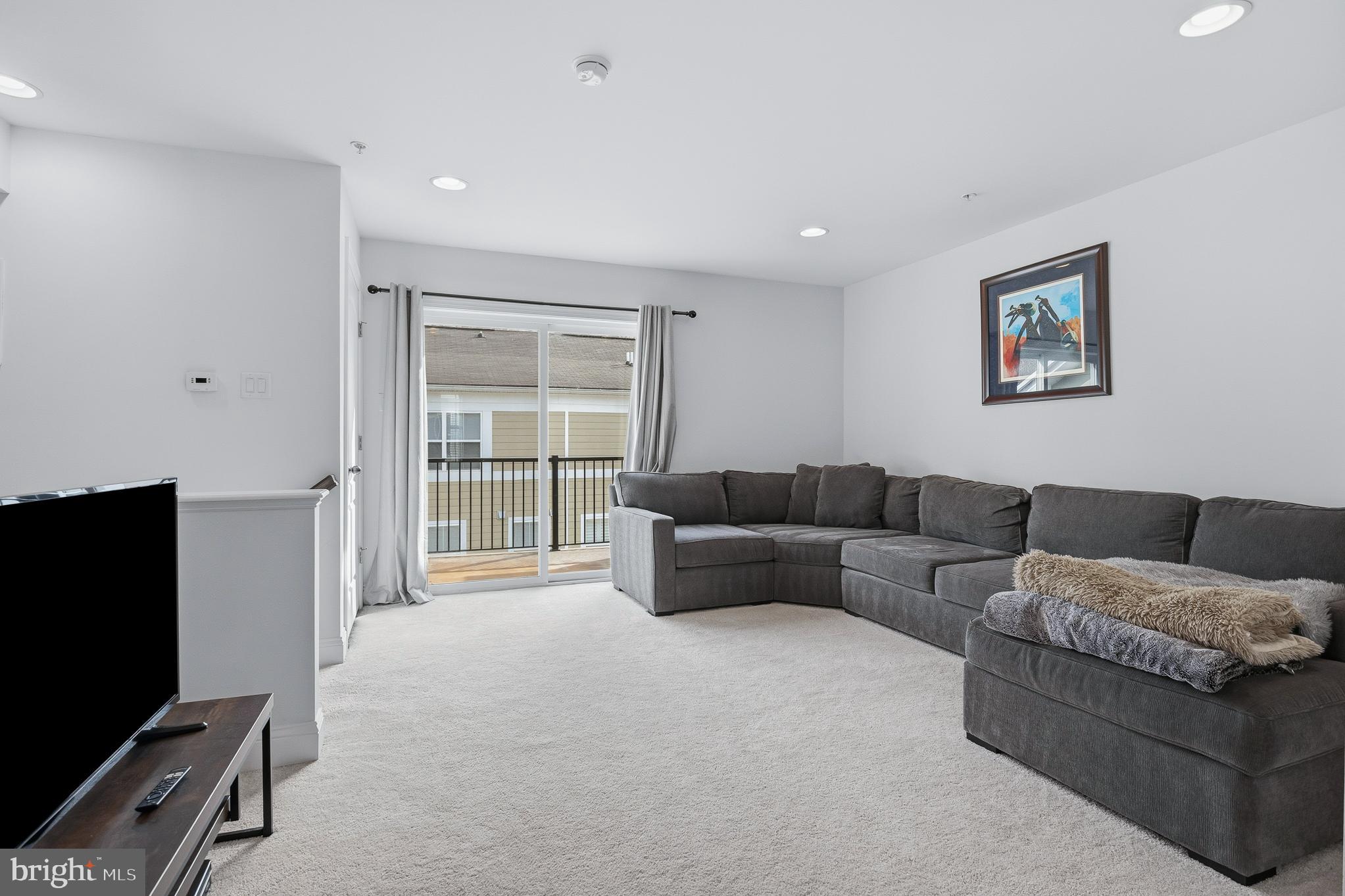 803 Francis Harris Place Annapolis, MD 21401 - Photo 38 of 52 a living room with furniture and a flat screen tv