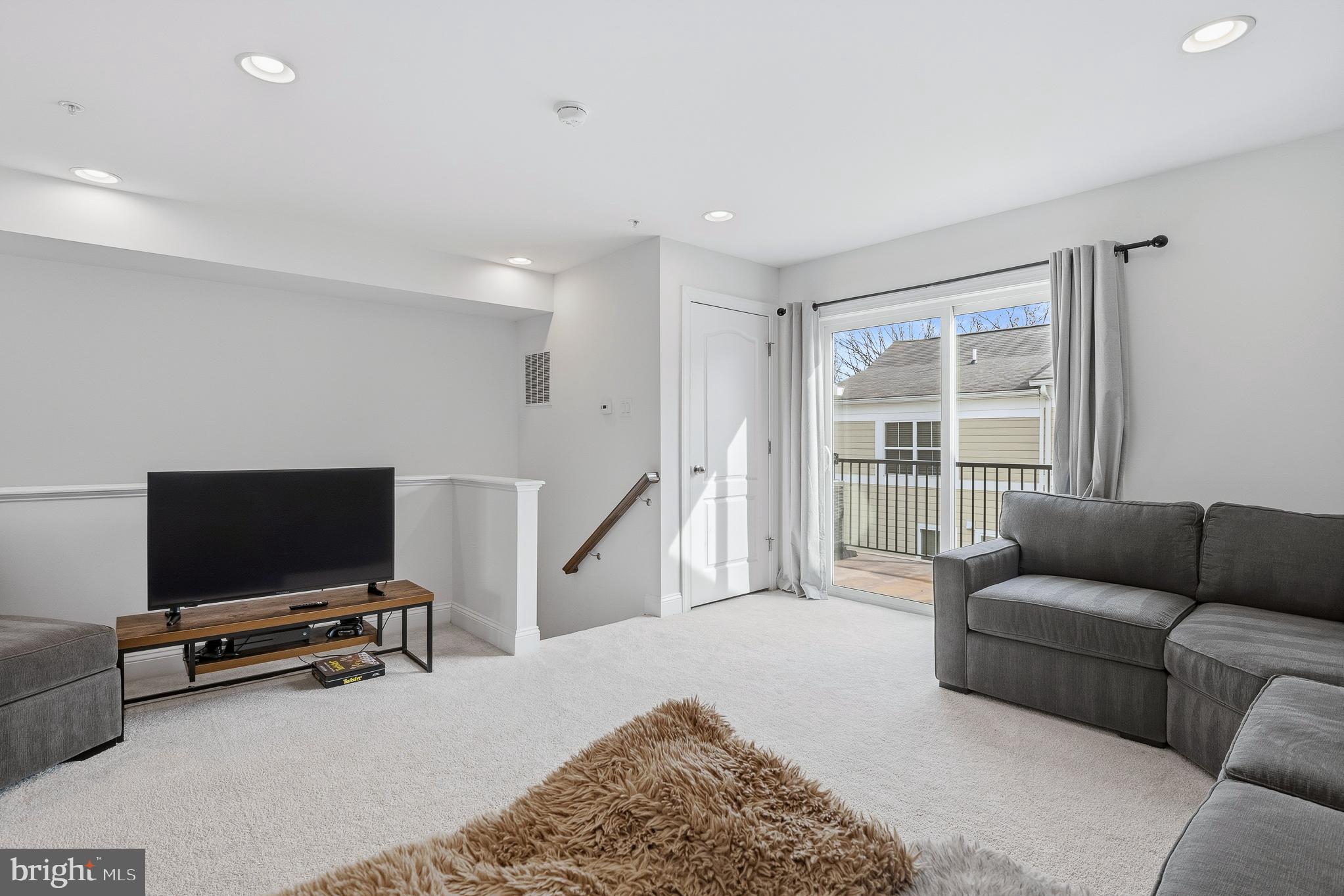 803 Francis Harris Place Annapolis, MD 21401 - Photo 39 of 52 a living room with furniture and a flat screen tv
