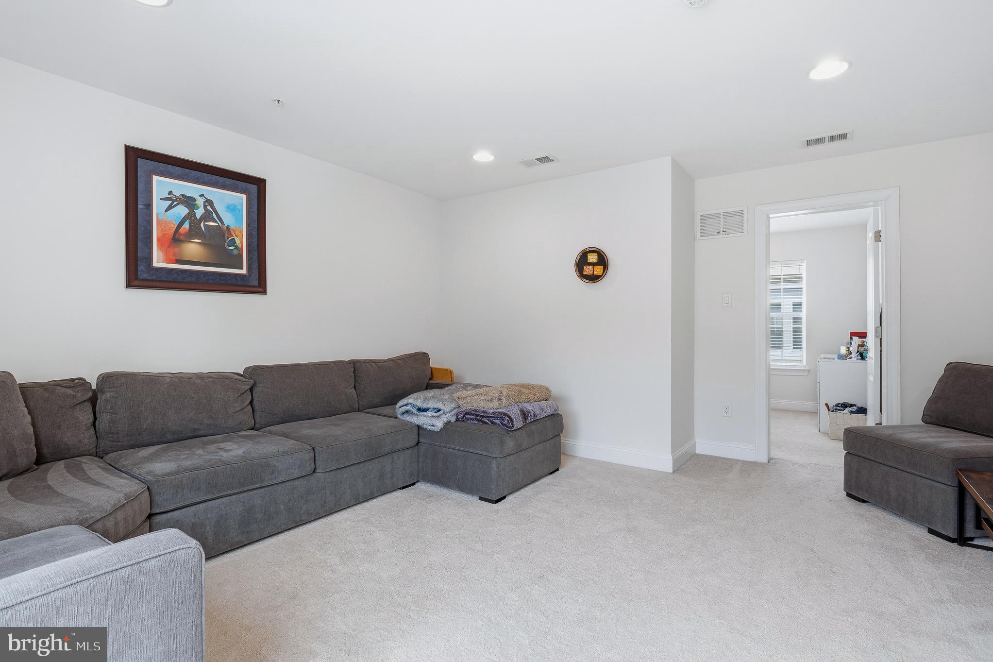 803 Francis Harris Place Annapolis, MD 21401 - Photo 41 of 52 a living room with furniture and a couch