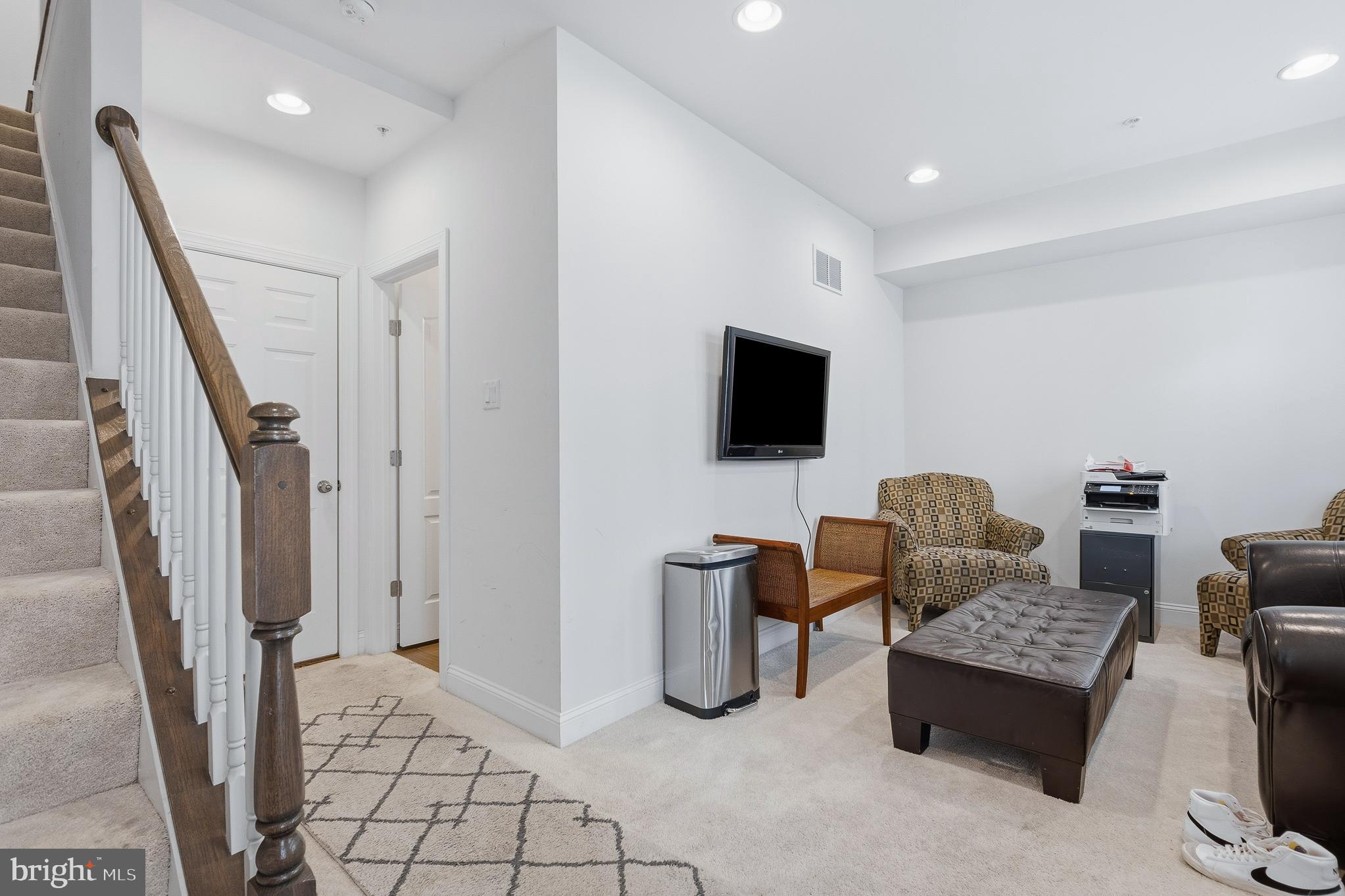 803 Francis Harris Place Annapolis, MD 21401 - Photo 8 of 52 a living room with furniture and a flat screen tv