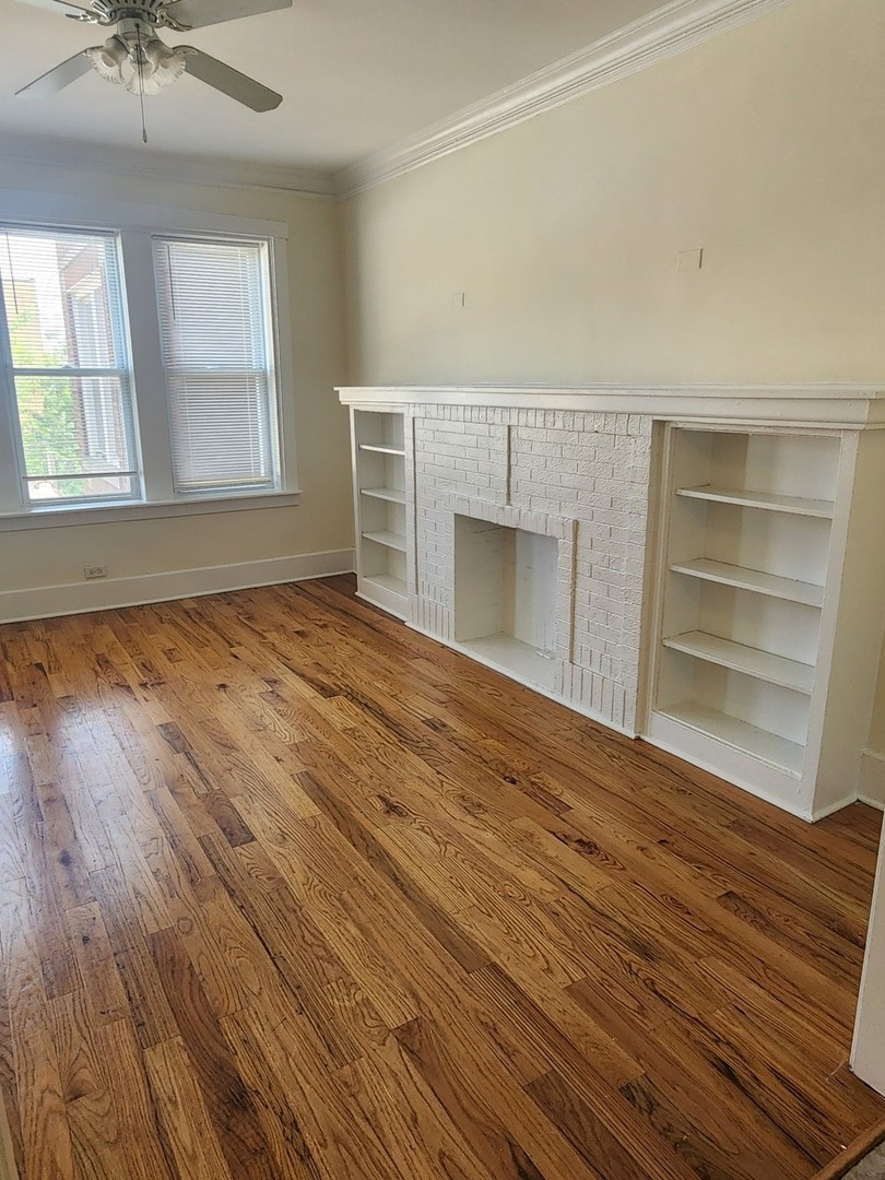 3219 West Division Street, Unit 2N Chicago, IL 60651 - Photo 4 of 14 a view of an empty room with a window and wooden floor