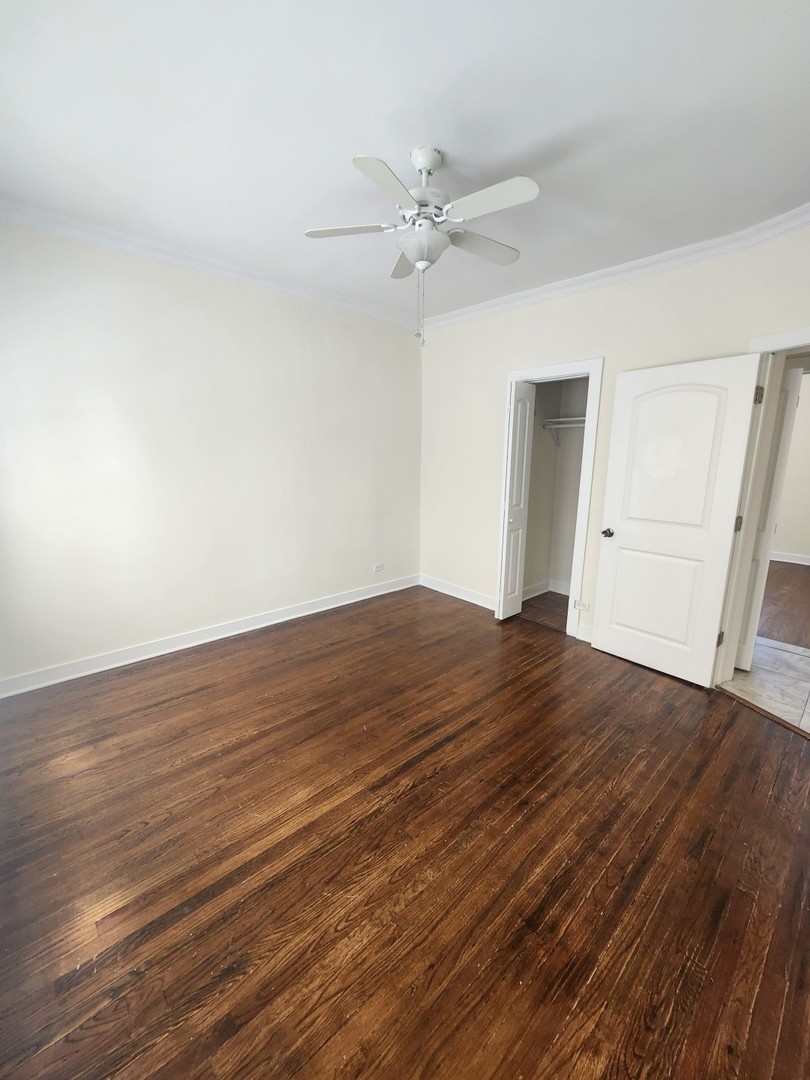 3219 West Division Street, Unit 2N Chicago, IL 60651 - Photo 7 of 14 a view of an empty room with wooden floor