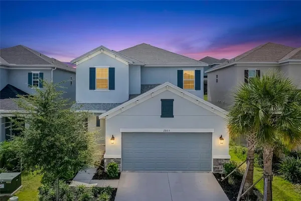a front view of a house with a garage