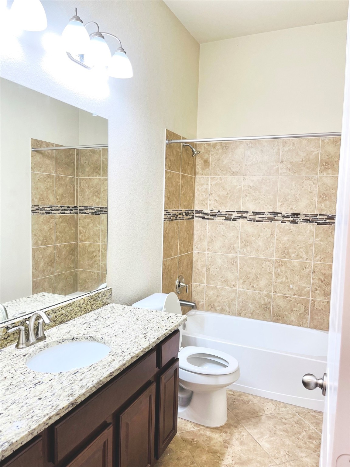 3430 Smart Sands Lane Fulshear, TX 77441 - Photo 13 of 25 a bathroom with a granite countertop sink a toilet and shower