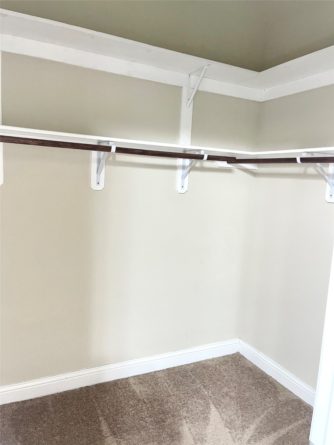 3430 Smart Sands Lane Fulshear, TX 77441 - Photo 20 of 25 a view of a room with racks on the wall