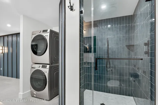 a bathroom with a sink a mirror and a shower