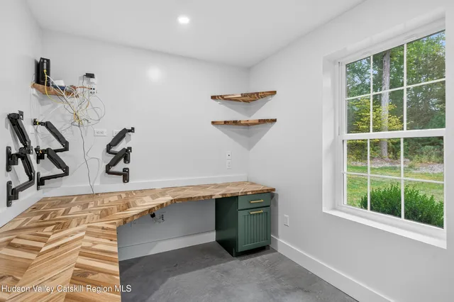 a room with window and cabinets