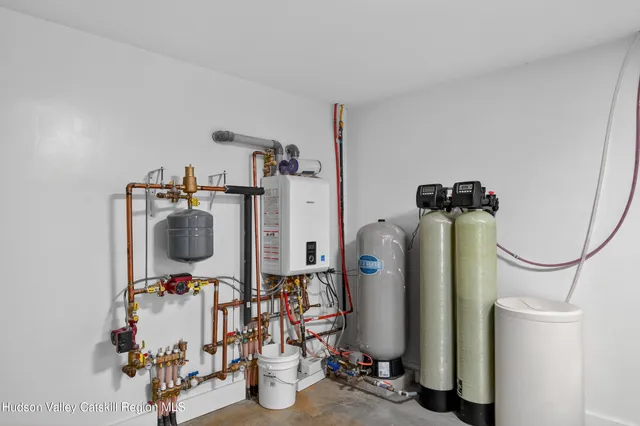 a backyard of a house with lots of green space and chair