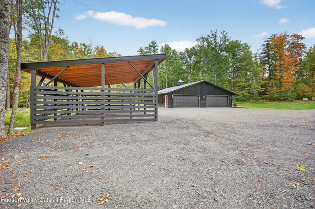a view of an house with backyard space and balcony