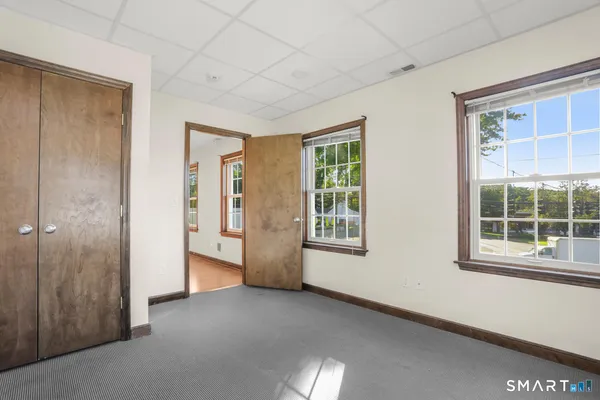 a view of an empty room with a window