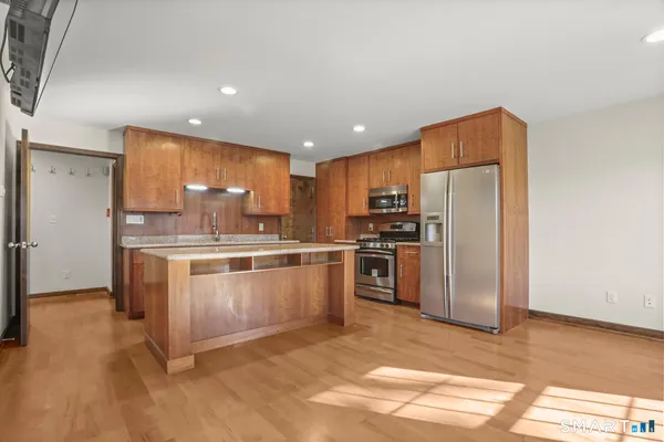 a kitchen with a refrigerator sink and microwave