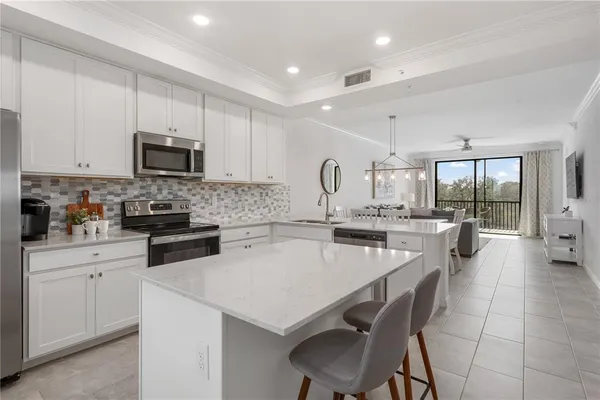 a kitchen with counter space cabinets and appliances