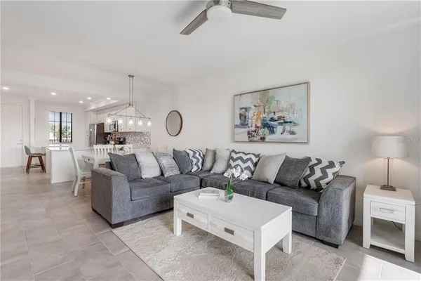 a living room with furniture and a painting