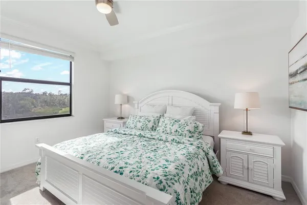 a room with a bed and a dresser
