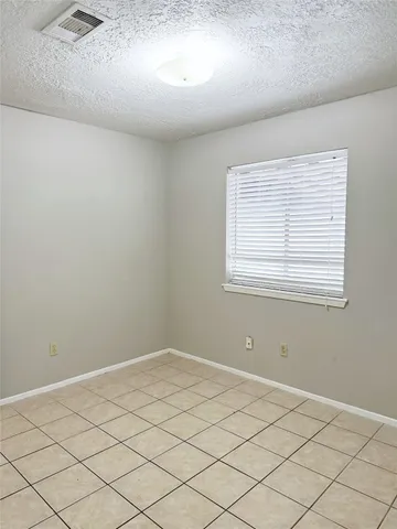 a view of a room that has a window in it
