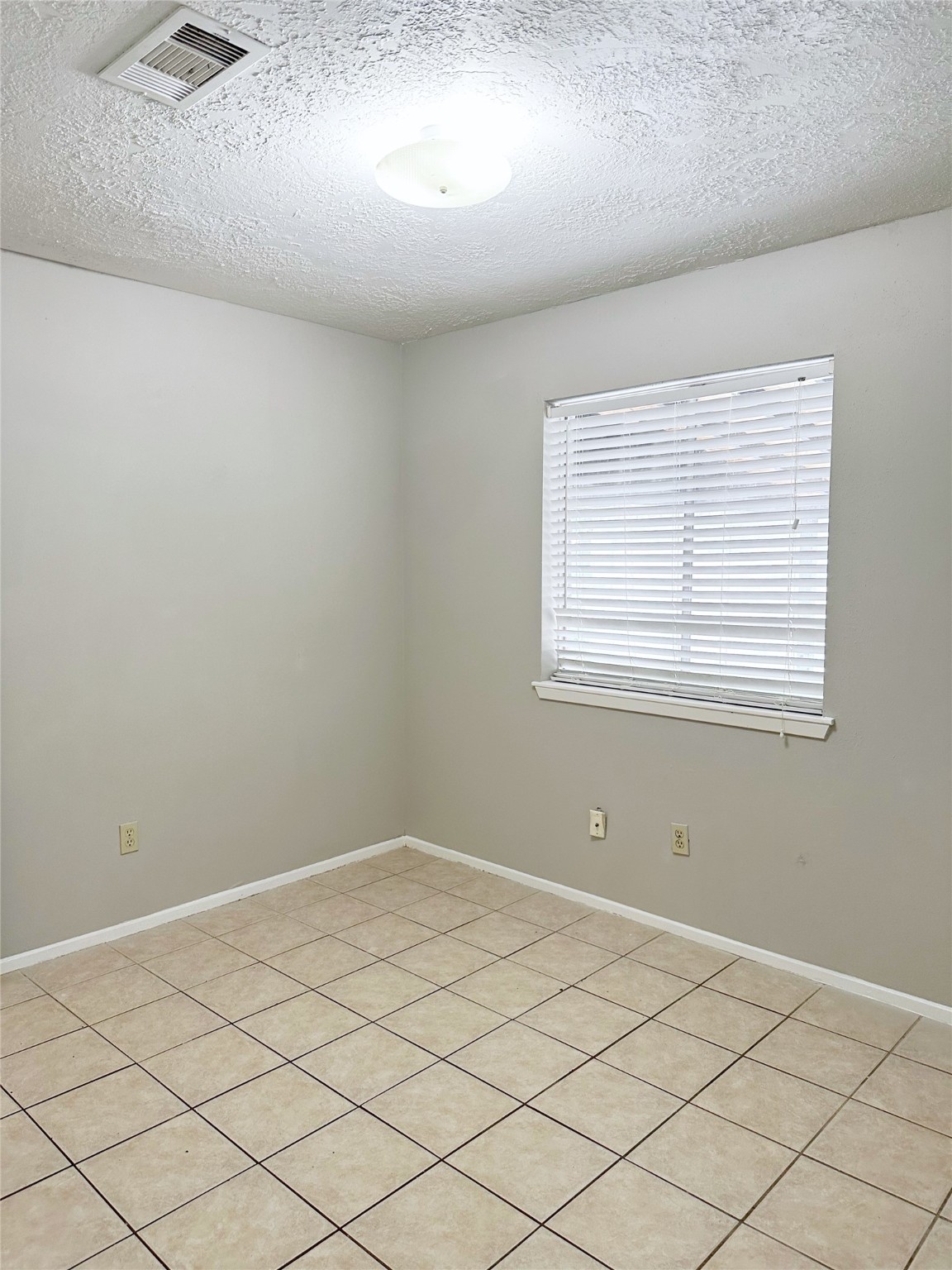 2402 Spring Dusk Drive Spring, TX 77373 - Photo 6 of 8 a view of a room that has a window in it