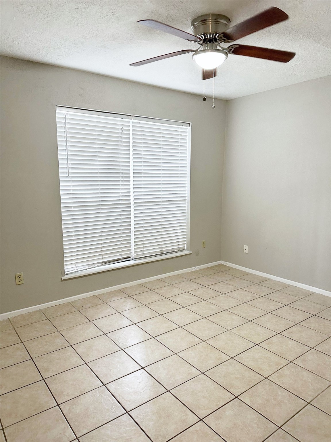 2402 Spring Dusk Drive Spring, TX 77373 - Photo 7 of 8 a view of an empty room and a window