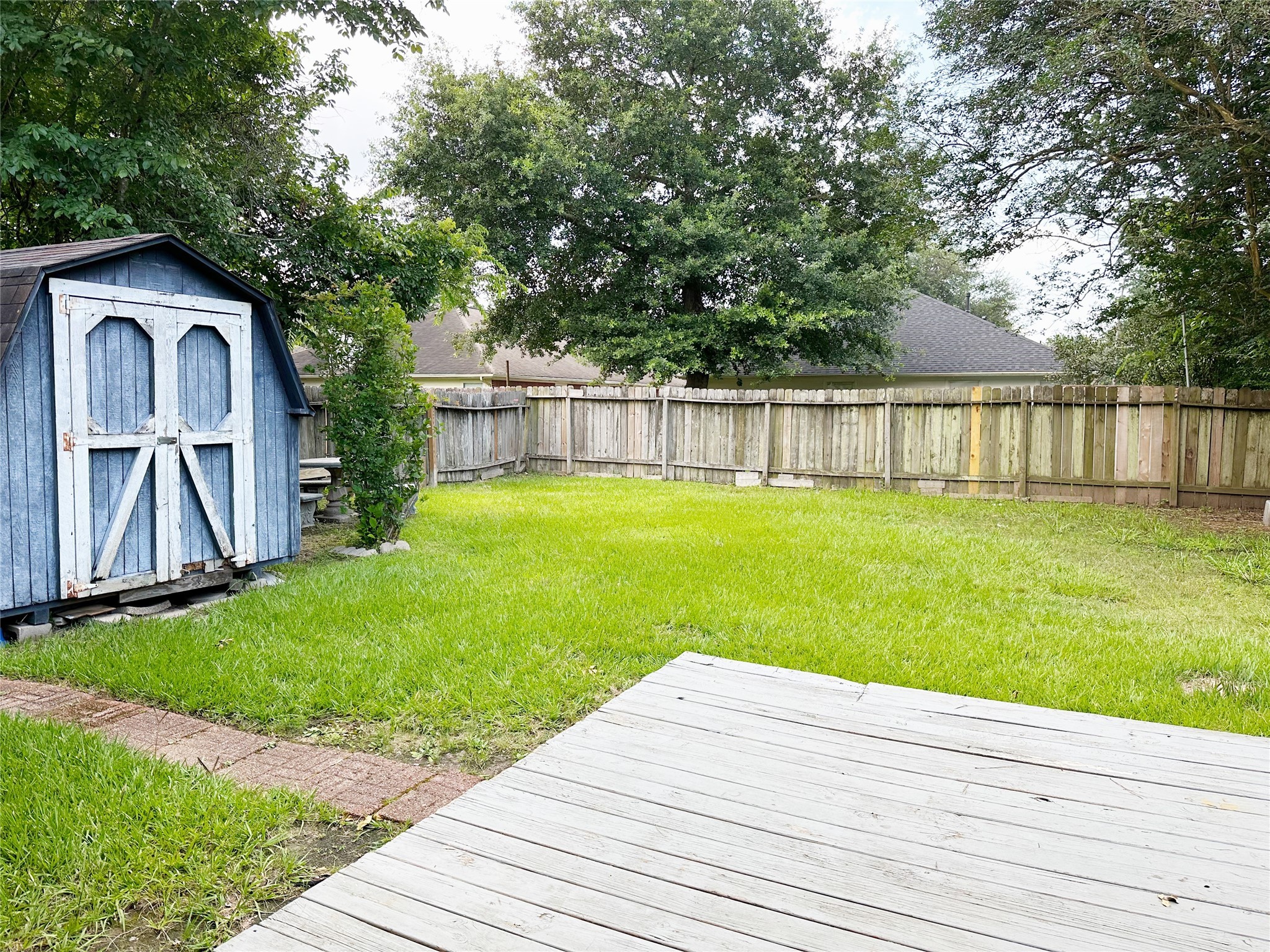 2402 Spring Dusk Drive Spring, TX 77373 - Photo 8 of 8 a backyard of a house with barbeque oven