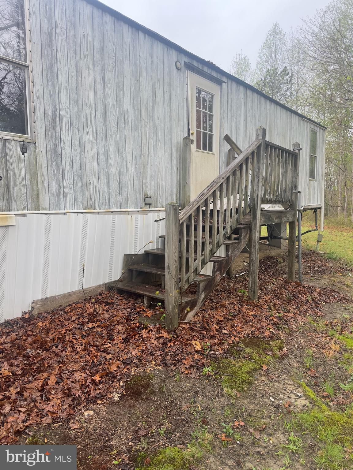 7833 Courthouse Road Heathsville, VA 22473 - Photo 12 of 18 a view of a house with backyard and wooden fence