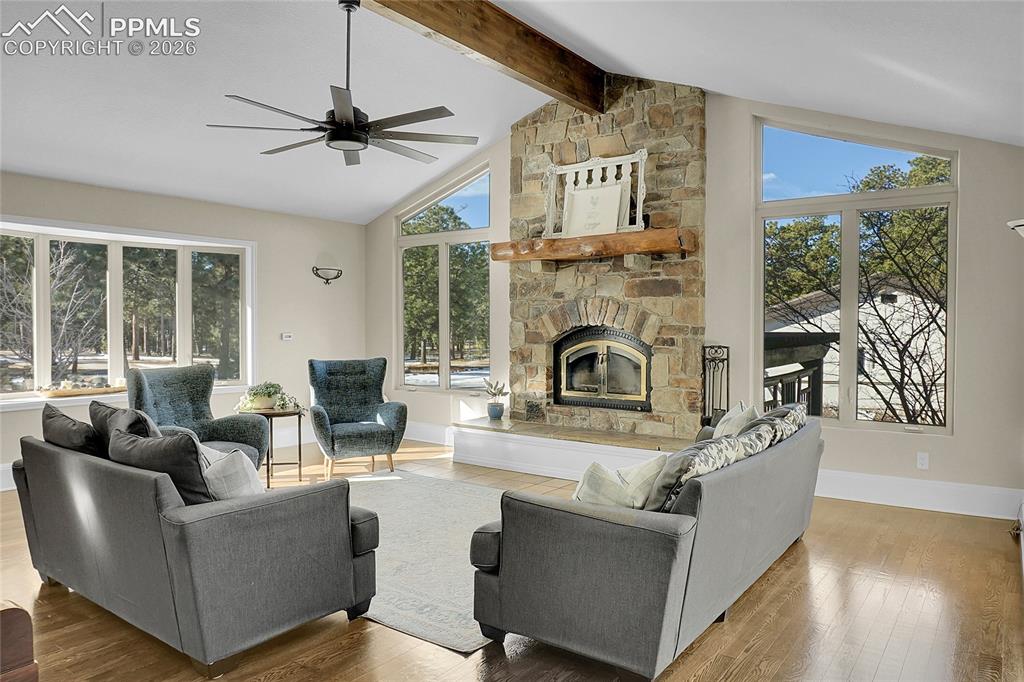 17350 Goshawk Road Colorado Springs, CO 80908 - Photo 8 of 50 a living room with furniture and a fireplace
