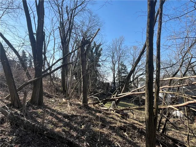 a view of a house with a yard covered with snow