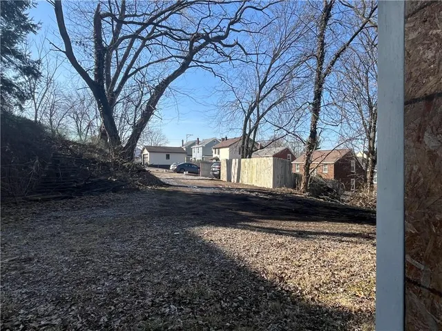 a front view of a house with parking space