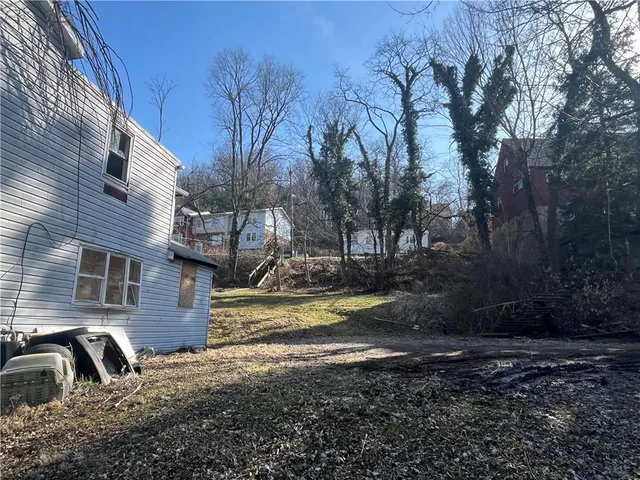 a view of a town with mountains in the background
