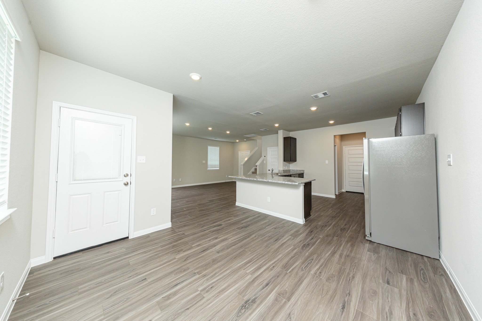 13663 Kit Run Splendora, TX 77372 - Photo 6 of 28 a view of kitchen with wooden floor