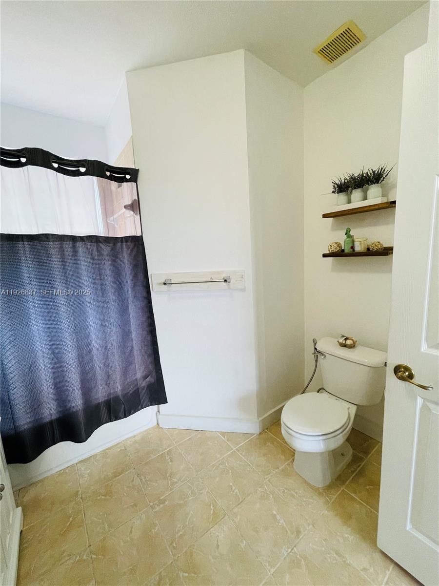 27312 Southwest 138th Path Homestead, FL 33032 - Photo 25 of 41 a bathroom with a toilet and a shower