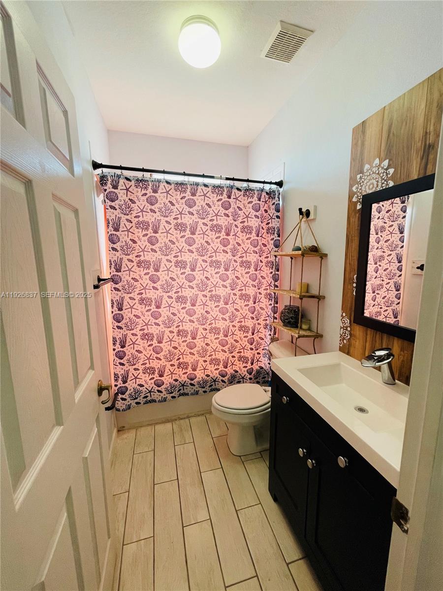 27312 Southwest 138th Path Homestead, FL 33032 - Photo 34 of 41 a bathroom with a sink toilet and shower