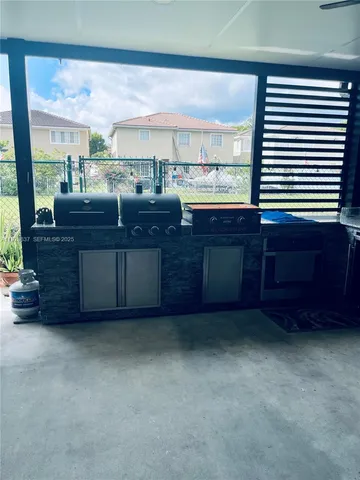 a room with lots of wooden furniture and a sink