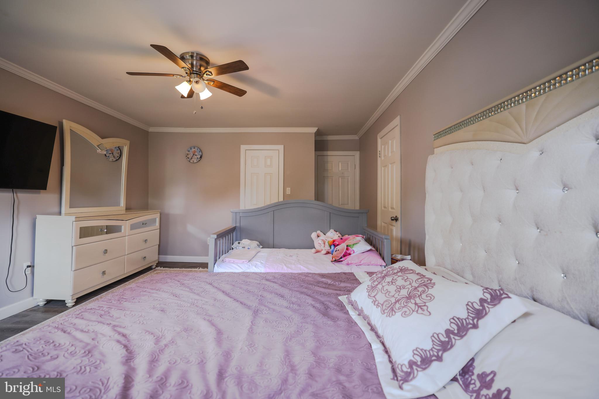 103 Garrison Court Langhorne, PA 19047 - Photo 29 of 46 a bedroom with a bed and a flat screen tv
