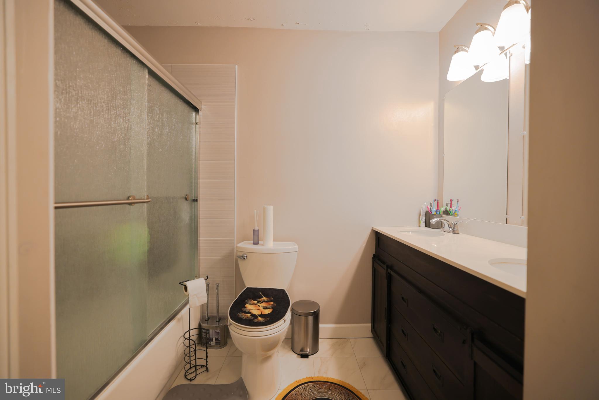 103 Garrison Court Langhorne, PA 19047 - Photo 33 of 46 a bathroom with a sink a toilet and a mirror