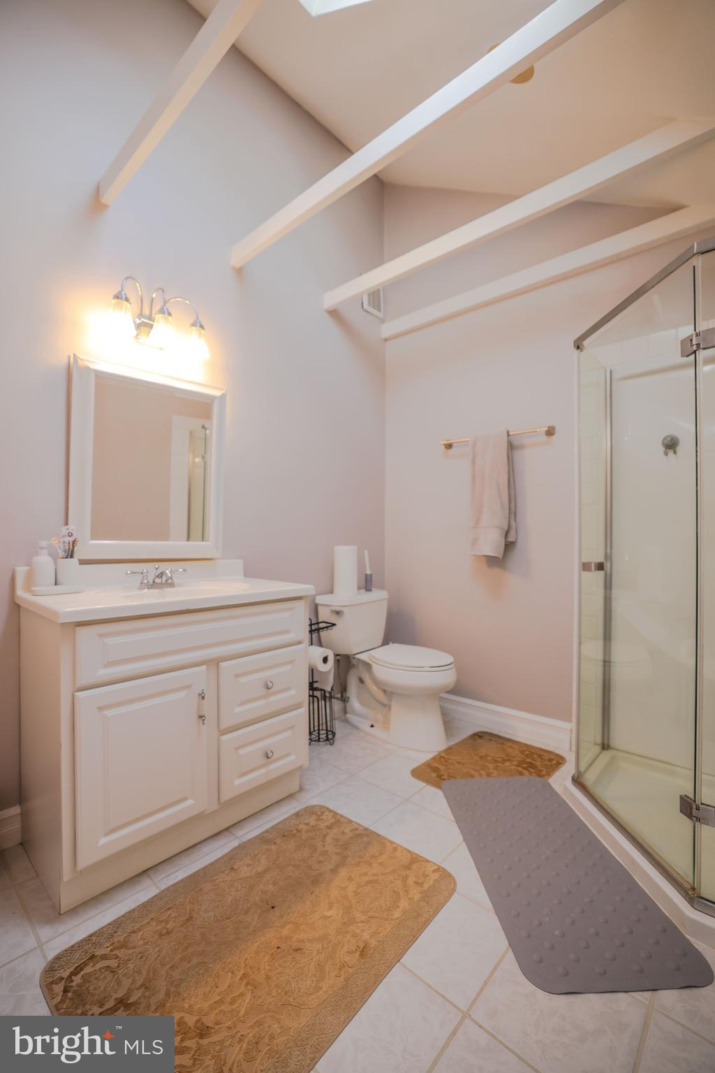 103 Garrison Court Langhorne, PA 19047 - Photo 37 of 46 a spacious bathroom with a bathtub shower sink mirror and toilet