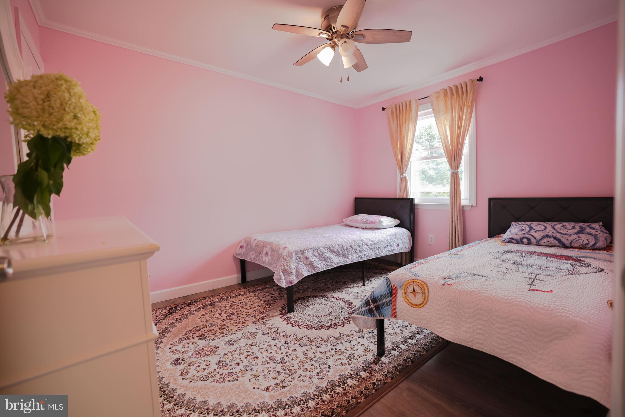 103 Garrison Court Langhorne, PA 19047 - Photo 38 of 46 a bedroom with a bed and a potted plant