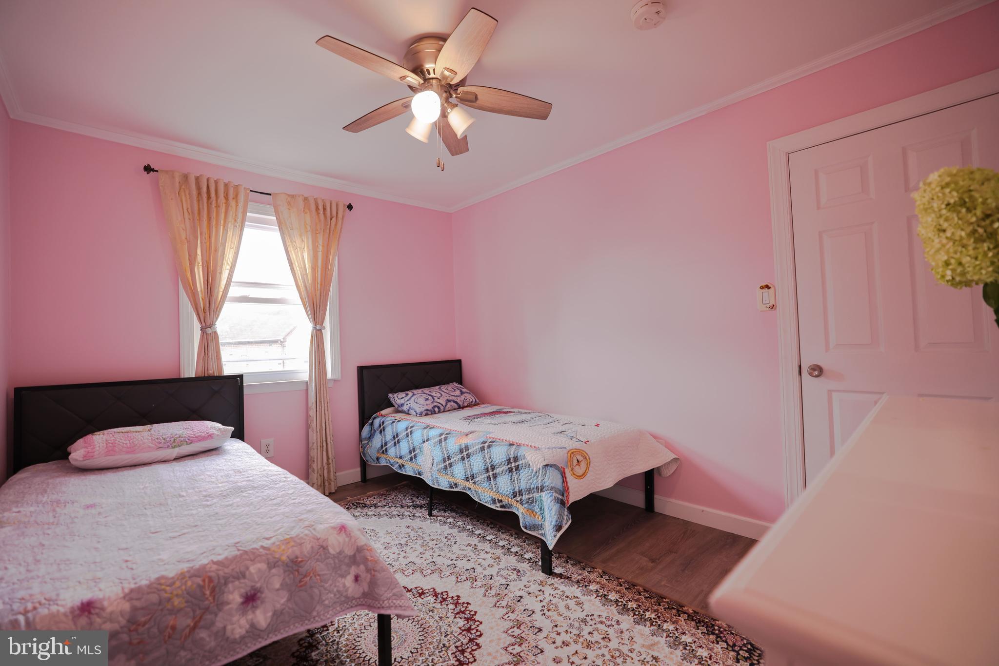 103 Garrison Court Langhorne, PA 19047 - Photo 39 of 46 a bedroom with two beds and a chandelier