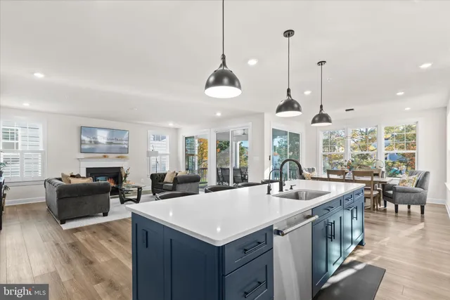 a view of a dining room with furniture large windows and wooden floor