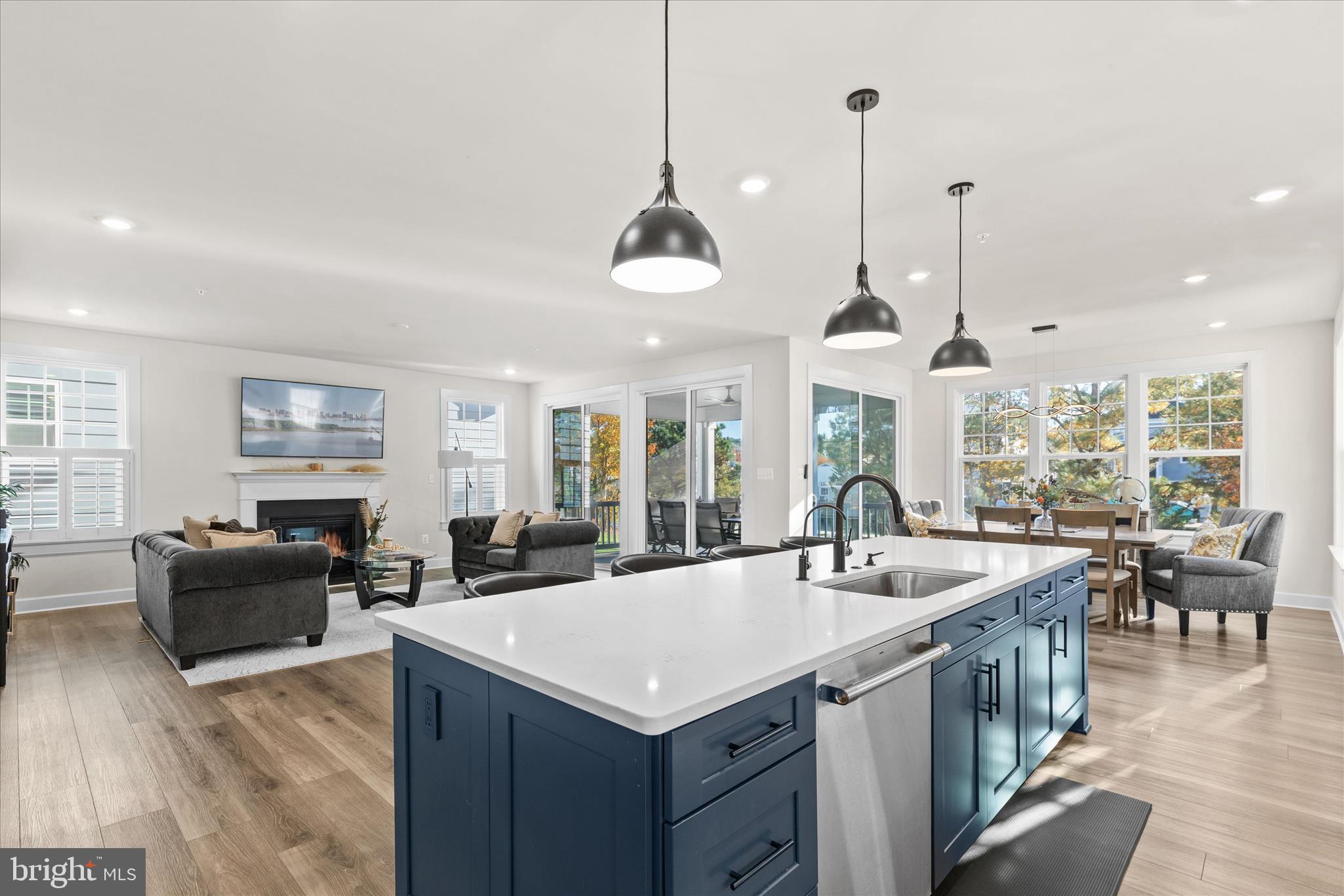 12377 Hidden Bay Drive Berlin, MD 21811 - Photo 15 of 71 a kitchen with granite countertop a sink a counter top space and living room view