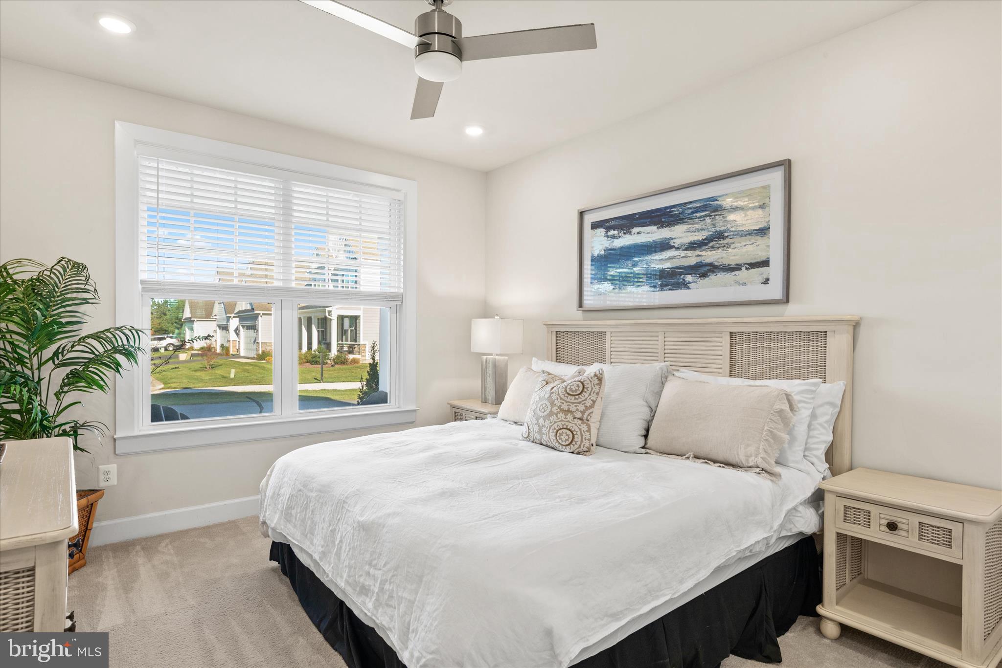 12377 Hidden Bay Drive Berlin, MD 21811 - Photo 20 of 71 a bedroom with a large bed and a large window