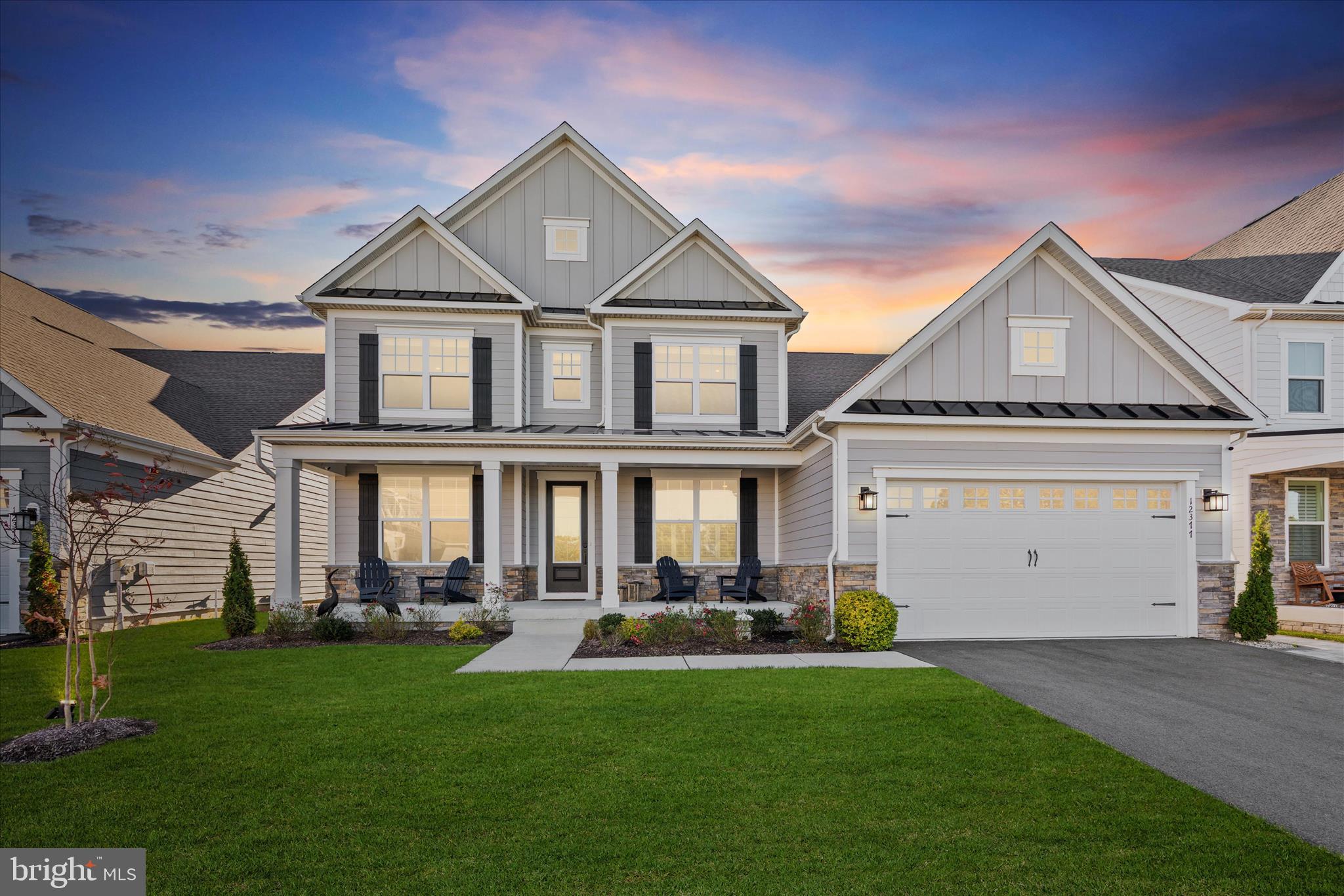 12377 Hidden Bay Drive Berlin, MD 21811 - Photo 2 of 71 a front view of a house with a yard