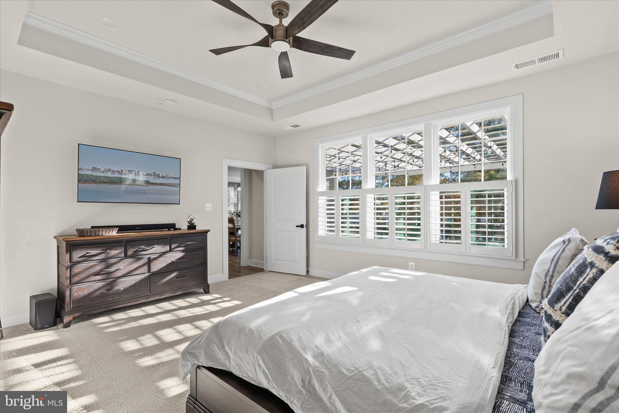 12377 Hidden Bay Drive Berlin, MD 21811 - Photo 24 of 71 a bedroom with a bed and a fireplace