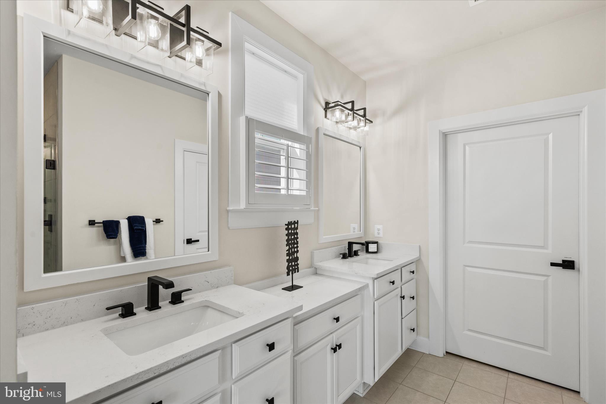 12377 Hidden Bay Drive Berlin, MD 21811 - Photo 25 of 71 a bathroom with double sink and a mirror