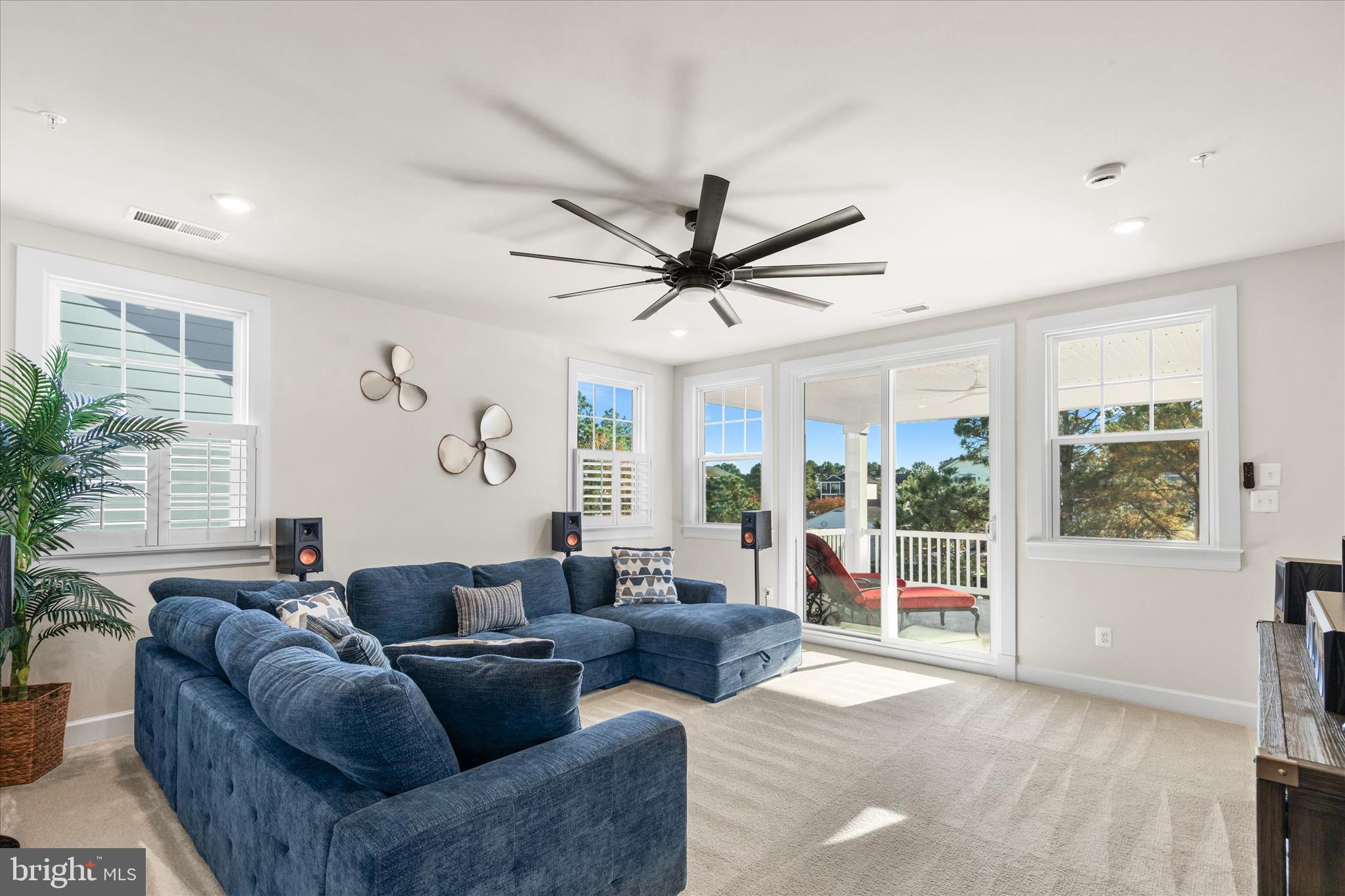 12377 Hidden Bay Drive Berlin, MD 21811 - Photo 33 of 71 a living room with furniture and a large window with garden view
