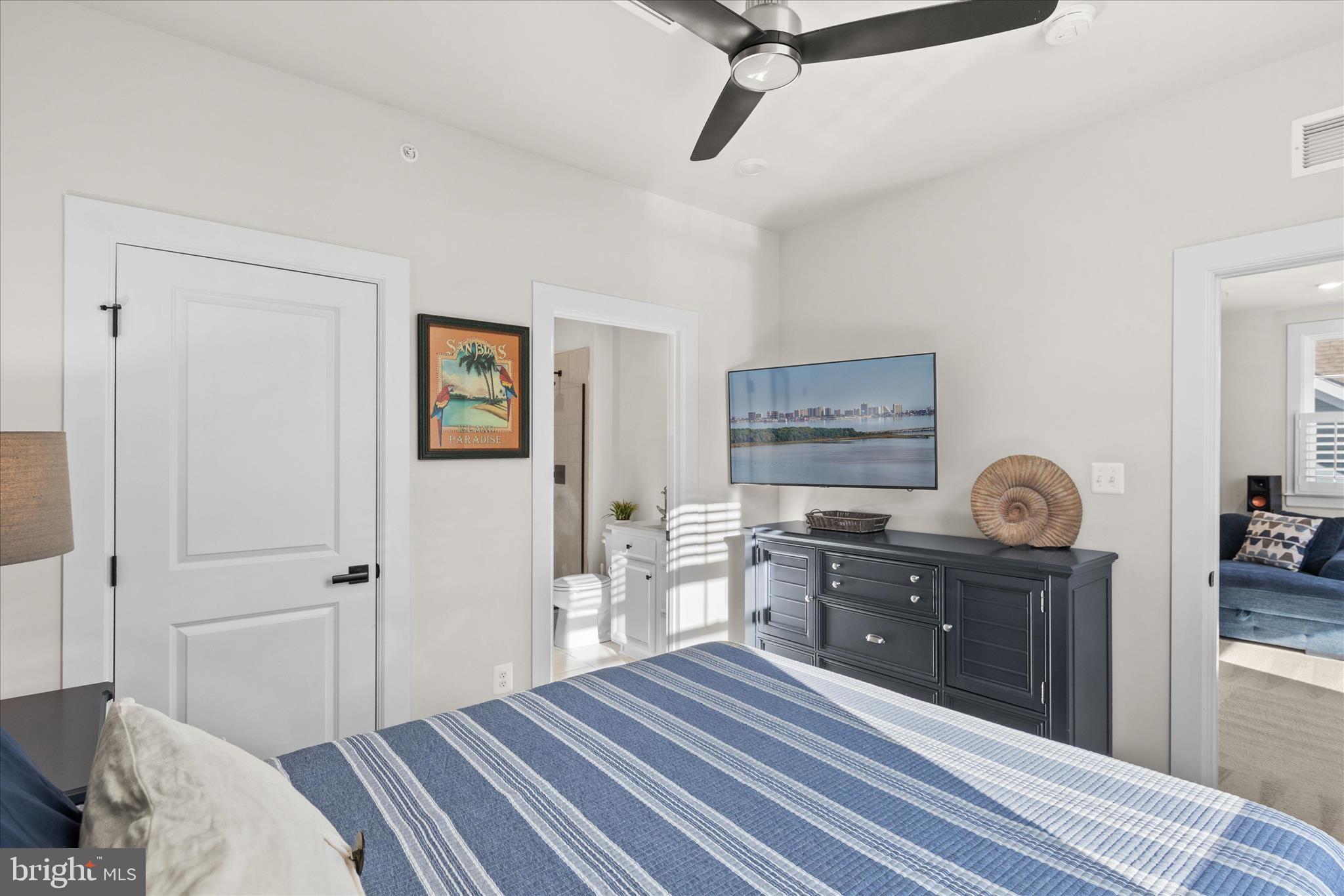 12377 Hidden Bay Drive Berlin, MD 21811 - Photo 35 of 71 a bedroom with a bed and wooden floor