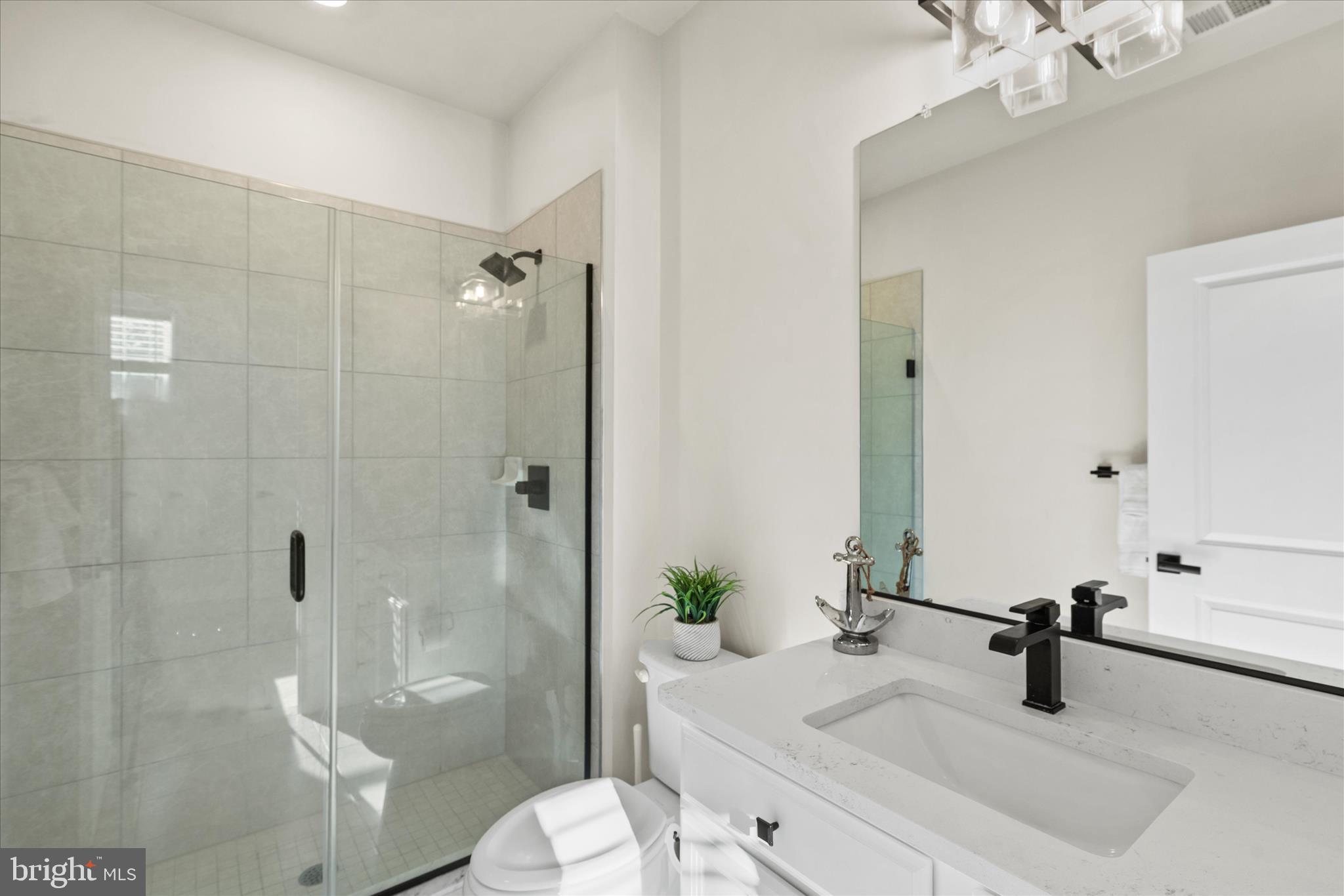 12377 Hidden Bay Drive Berlin, MD 21811 - Photo 36 of 71 a bathroom with a sink a toilet and shower